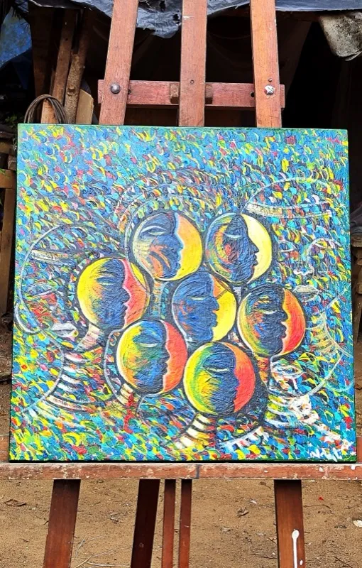 Abstract painting with faces in blue and gold