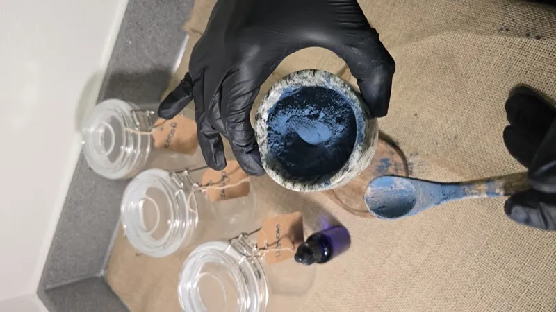 Indigo pigment bowl with labeled ingredient jars